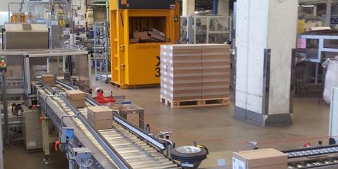yellow baler in warehouse