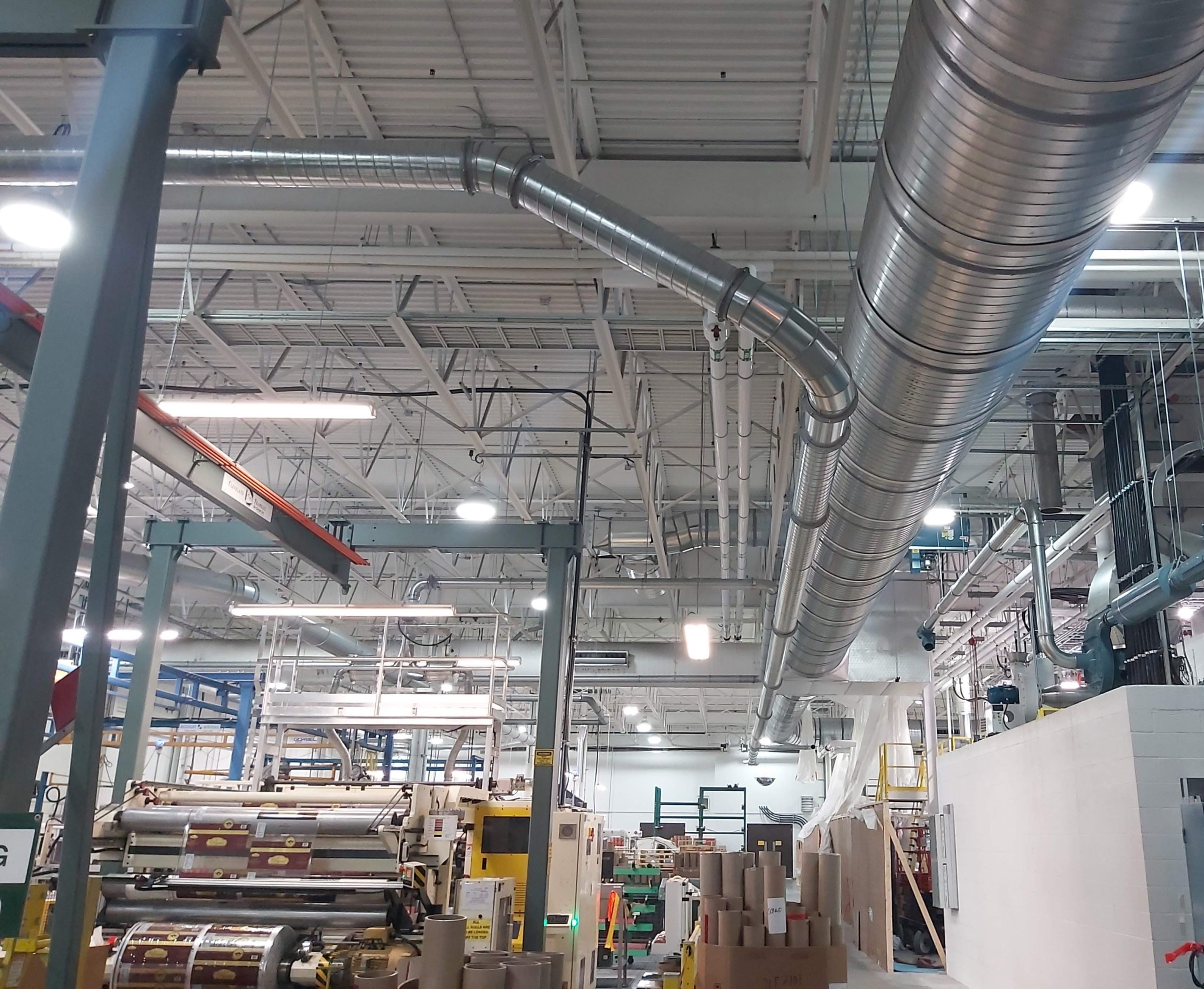 ducting running along roof of a flexible packaging facility