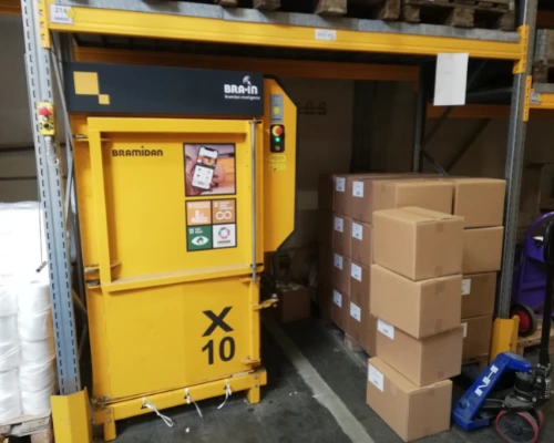 yellow x10 baler under warehouse rack