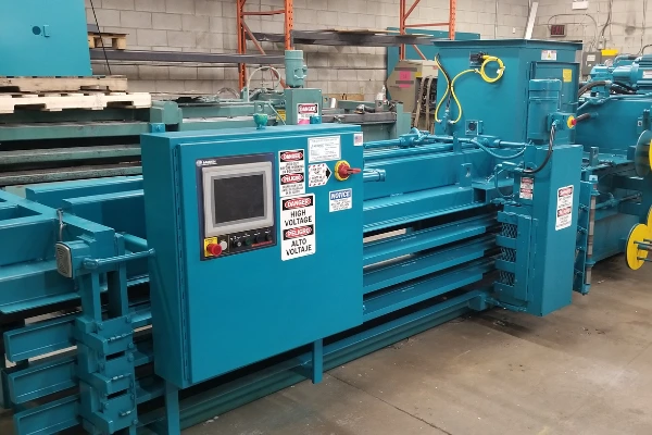 teal reconditioned baler with hmi touchscreen